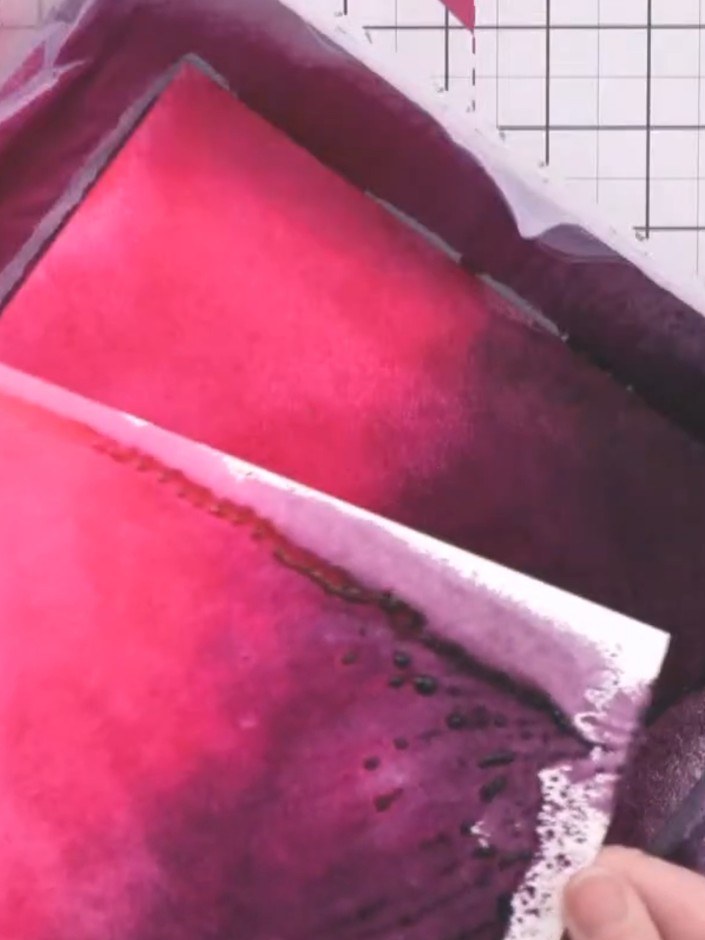 Step 4: Press a fresh piece of white cardstock onto the wet sprayed surface to take a second print. Lift the cardstock