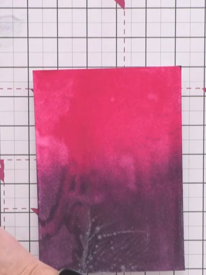 Step 5: Once the background is dry, stamp the mini mandala element from the dream catcher stamp set onto the pink and 