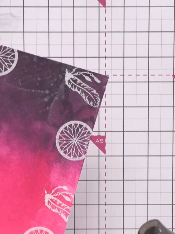 Step 7: Heat set all the white embossed images using a heat tool to bring them into sharp relief against the coloured 