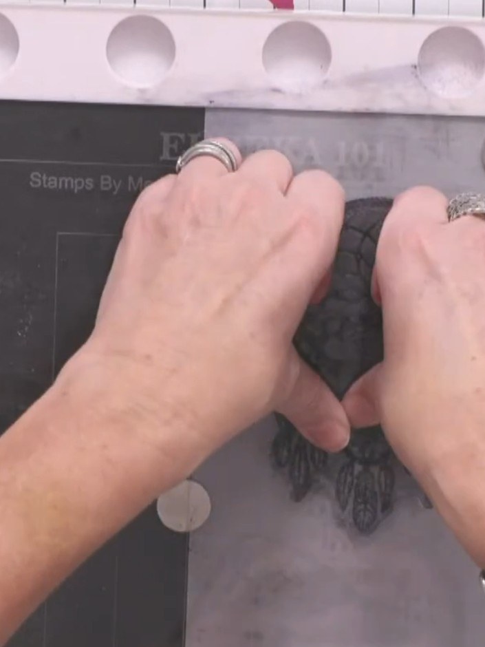 Step 9: Heat set the embossed vellum using a heat tool. The vellum will set almost instantly as the heat passes straig