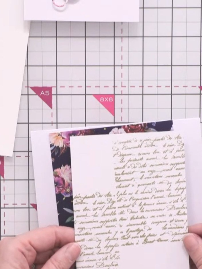 Step 4: Adhere the script-stamped white cardstock directly behind the vellum layer with the floral pattern and gold fo