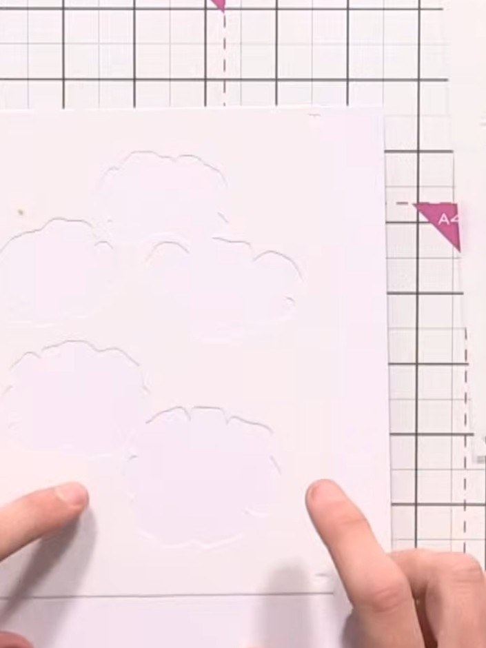 Step 1: Place white card stock on your craft mat. Position the first layering stencil from the Beautiful Buttercups se