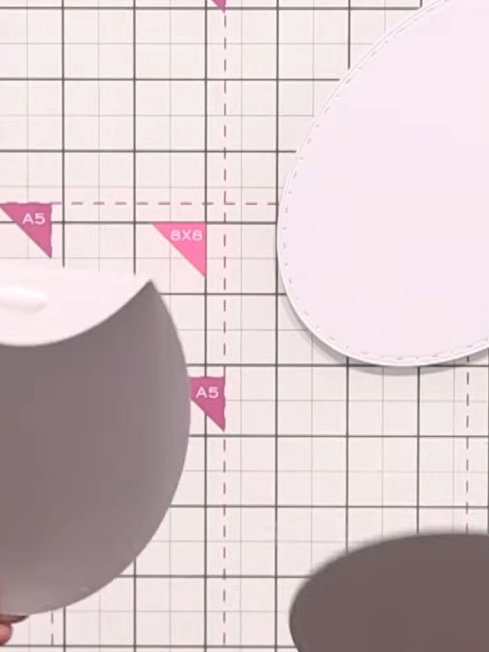 Step 11: Die-cut two large oval shapes from grey card stock using the waste-free oval stencil die. Score along the top 