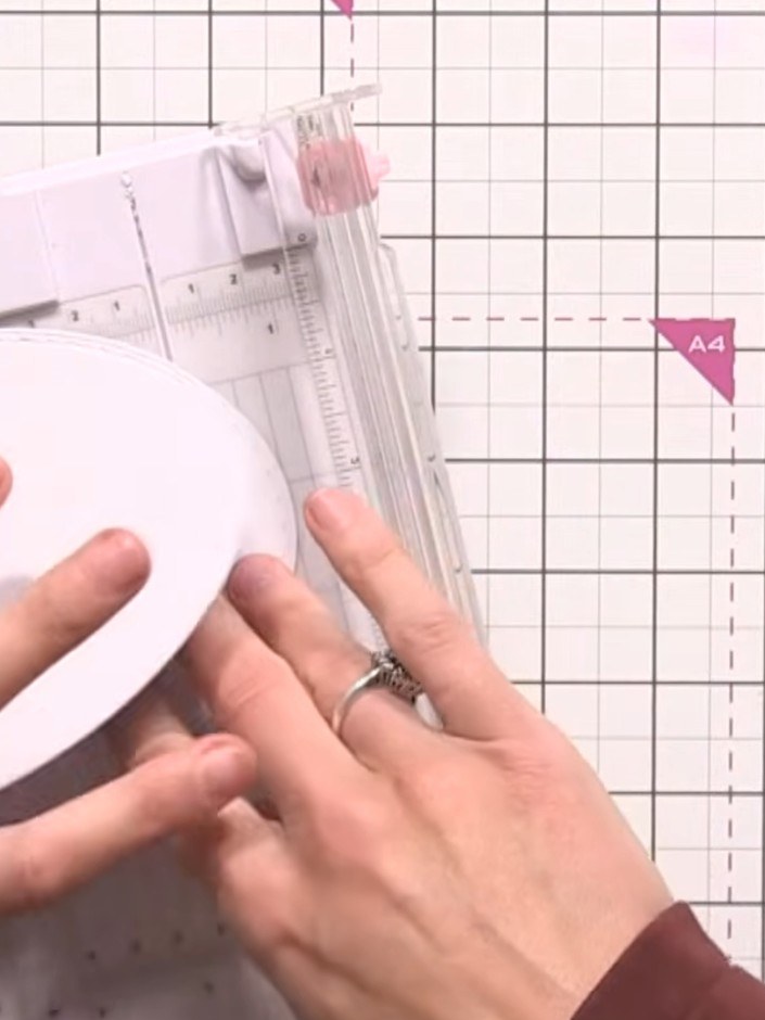 Step 14: Using your paper trimmer, trim a small notch from the bottom edge of the back oval piece. This allows the card