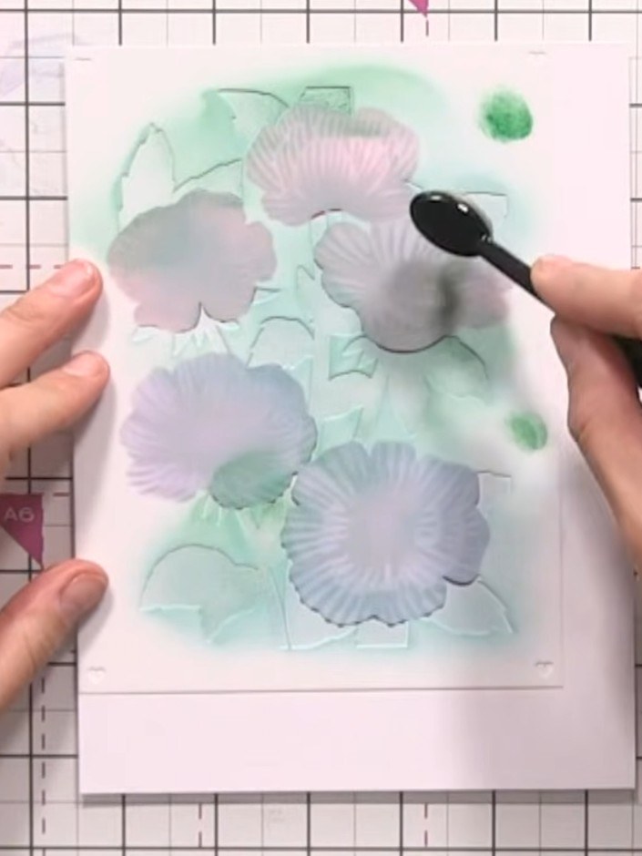 Step 6: Using a smaller brush, add darker green shadow detail to the leaves. Drag the colour from the stencil outward 