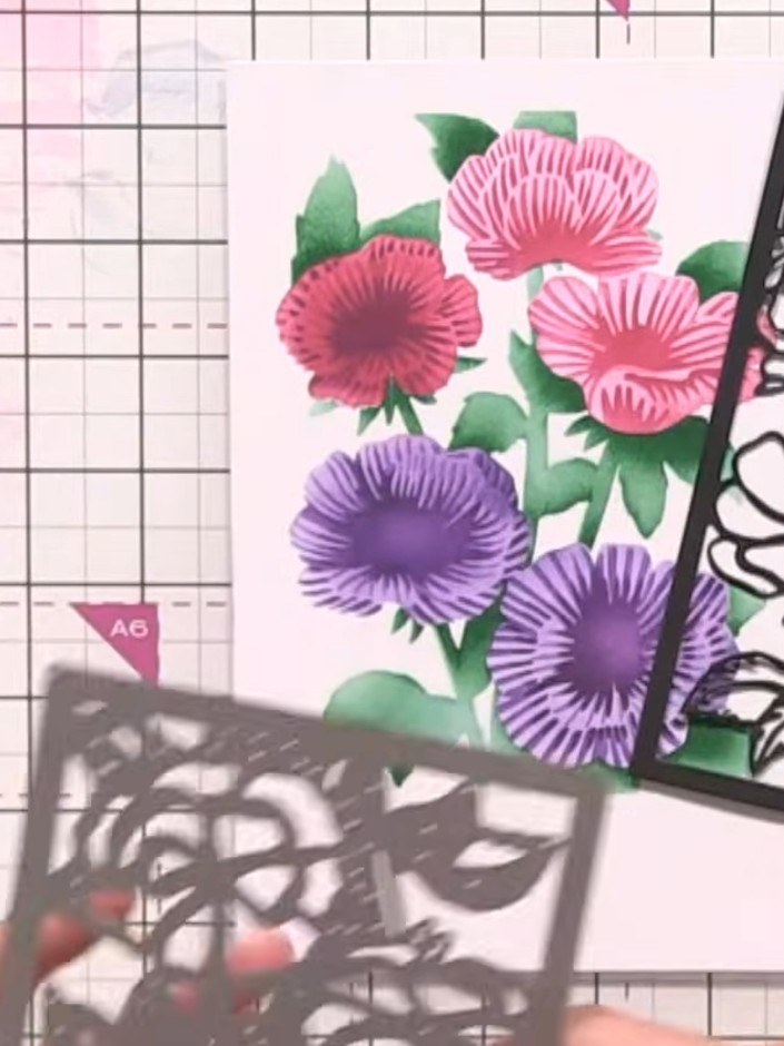 Step 7: Die-cut the floral frame from black card stock. Place a piece of card underneath to protect your die-cutting m