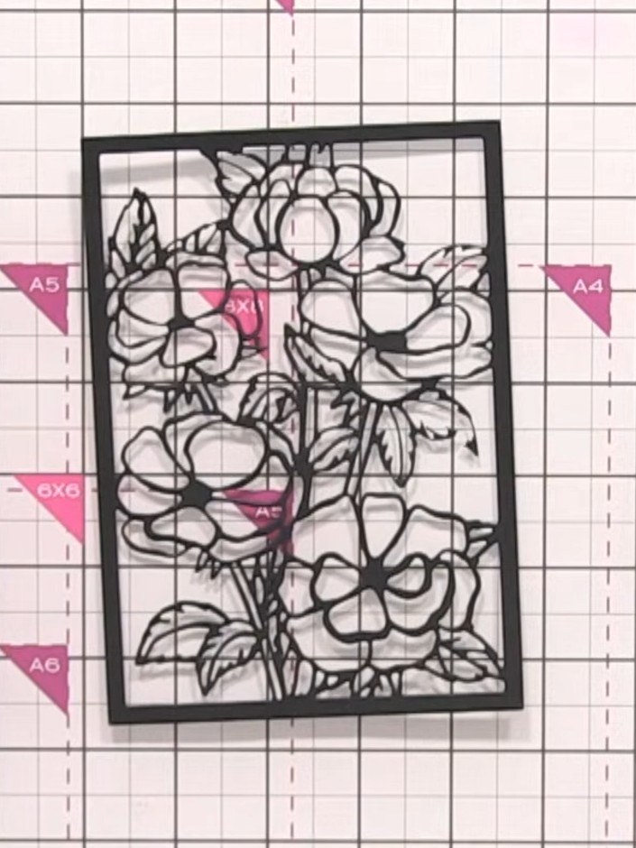 Step 8: Apply antique gold finger wax to the black die-cut frame. Rub it on selectively to create a vintage, brushed m