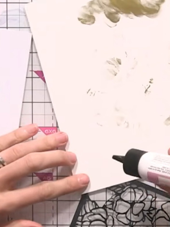 Step 9: Apply glue to the back of the black floral frame piece. Position and adhere it onto your layered flower panel,