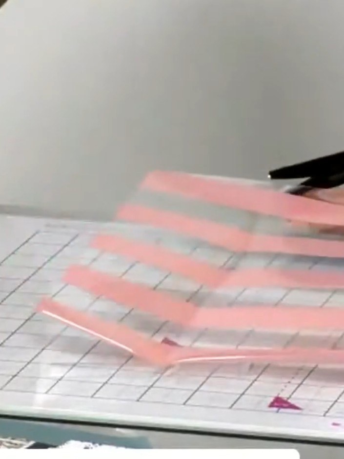 Step 9: Apply adhesive to one side of the acetate envelope and fold over to seal the edge.