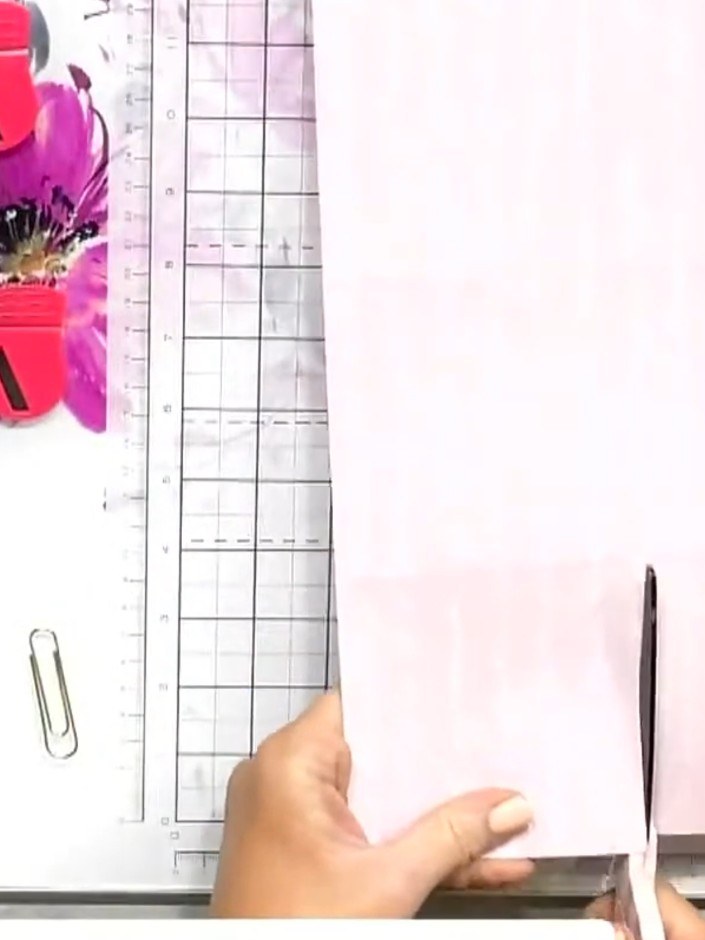 Step 3: Rotate the pink paper 90 degrees on your cutting mat so the longer edge is now horizontal.