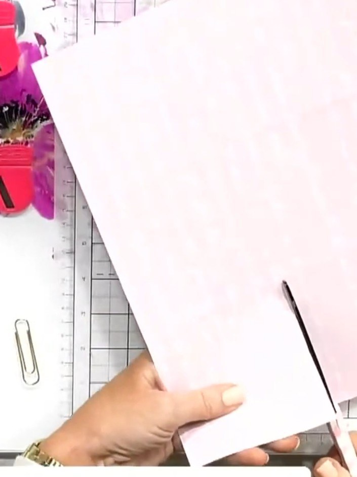Step 4: Rotate the pink paper 90 degrees. Score at 4 inches (approximately 10 cm) from the edge using your scoring boa