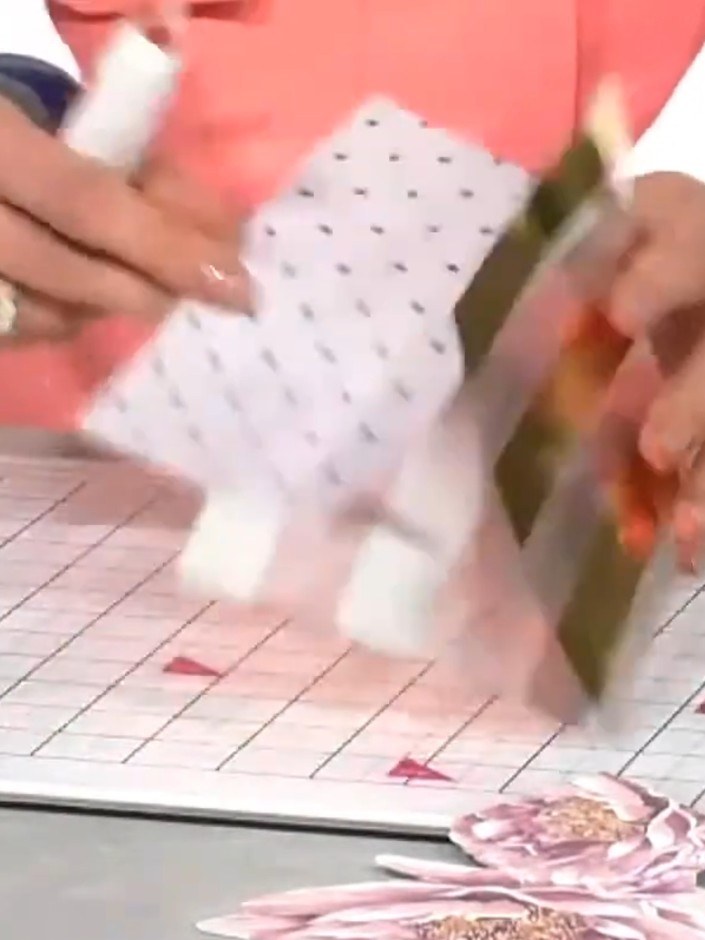 Step 4: Adhere the fussy-cut flower to the front of the acetate card using clear tape or liquid adhesive. Position the