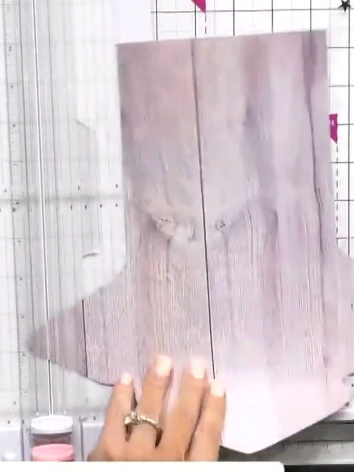 Step 7: Insert the completed signature into the pocket of the main book cover, sliding it carefully into place.