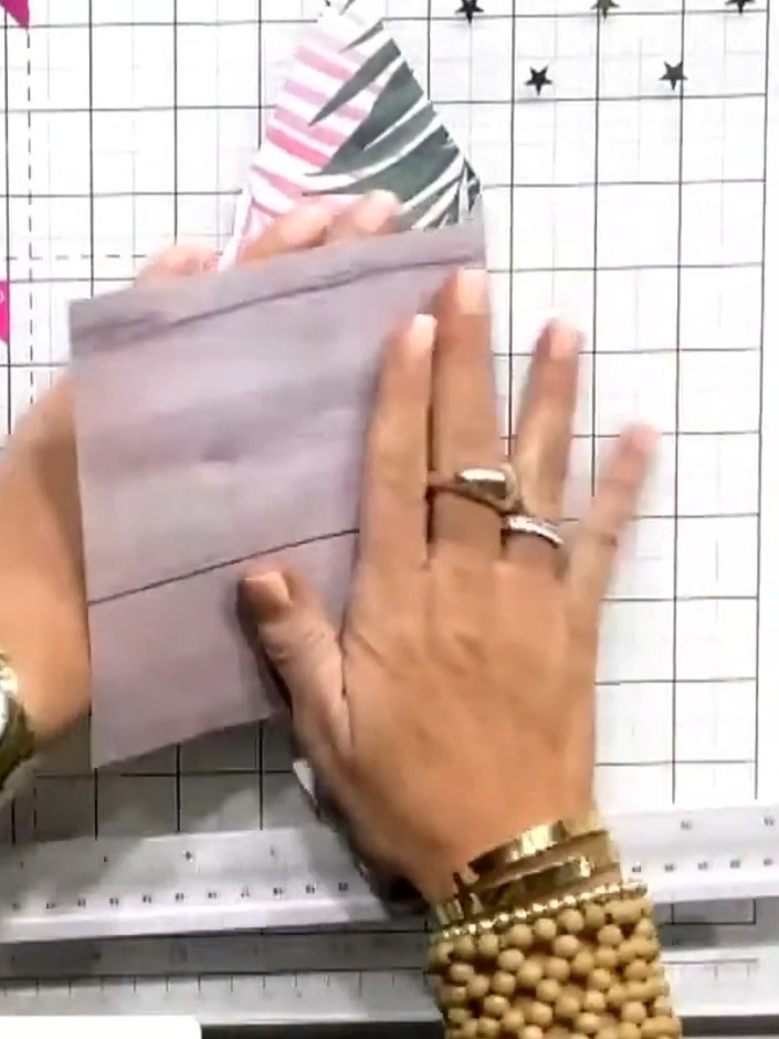 Step 8: Use the 3D embossing folder to emboss the palm leaf patterned cardstock, creating dimensional texture on the d