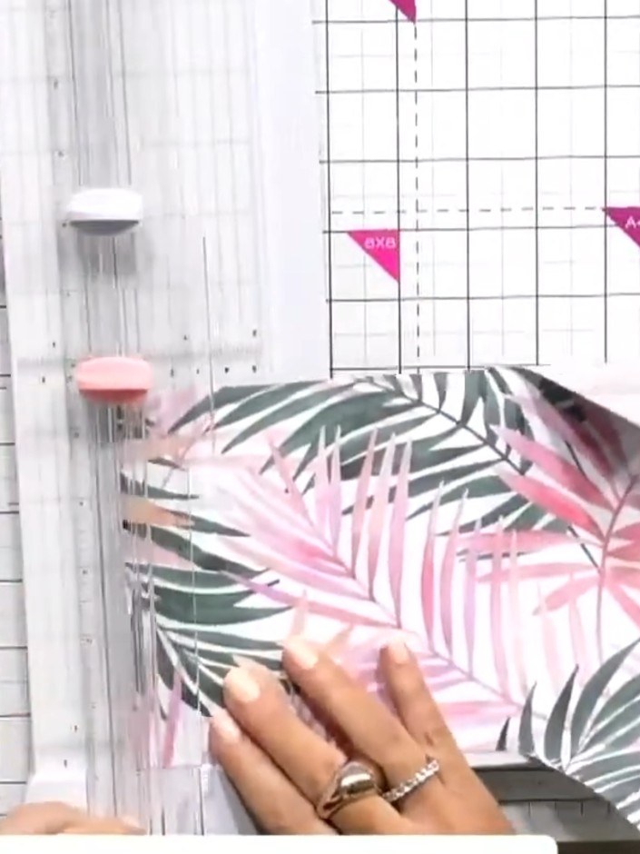 Step 9: Layer the embossed pink and grey palm leaf pieces together with the die-cut flowers and tuck them into the poc