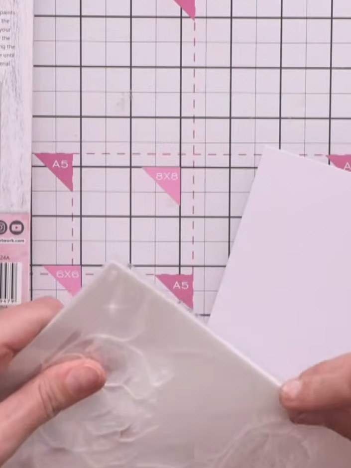 Step 1: Line up the first stencil (numbered 5) with the top corner of your white card, aligning it with the edge.
