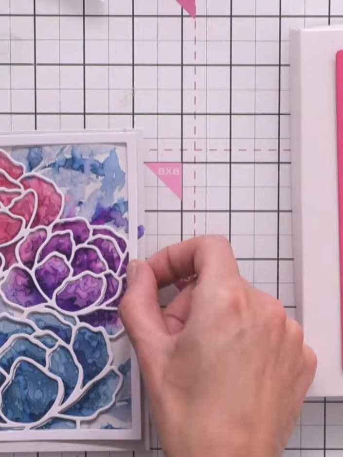 Step 10: Layer the white die-cut peony frame on top of your stencilled artwork panel to bring out all the floral detail