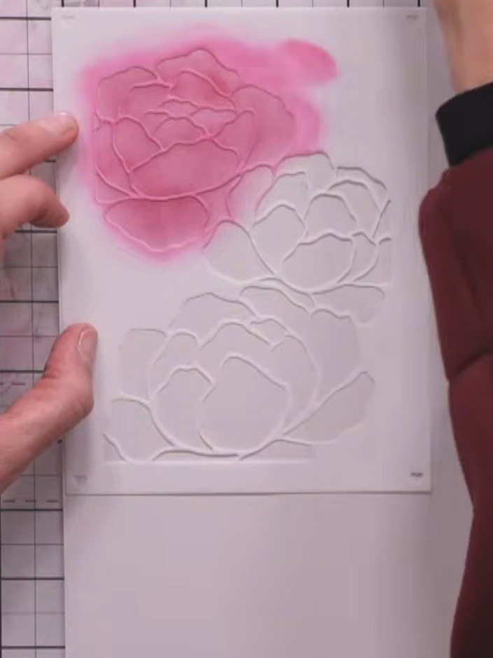 Step 4: Ink the middle flower section using purple ink. Press down firmly with your brush to apply the colour evenly a