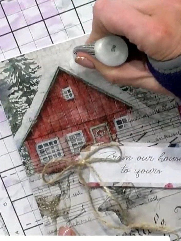 Step 4: Apply sparkle or glitter to the roof area of the house using a glitter applicator tool. Gently dab the applica