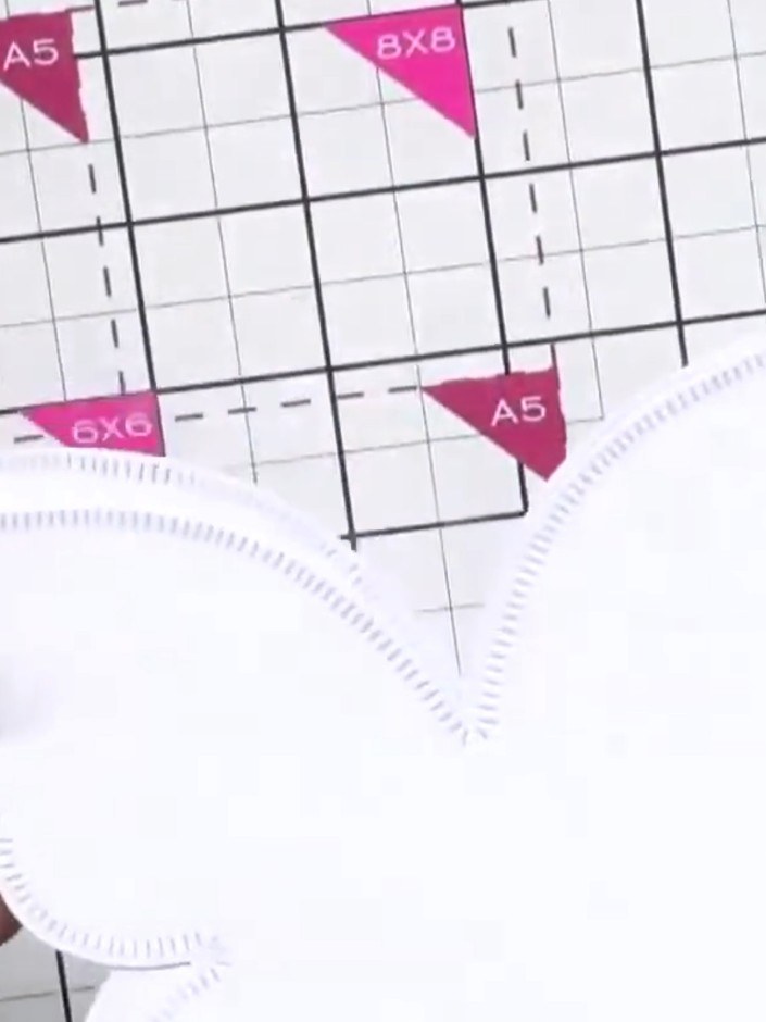 Step 2: Trim away sections of the die-cut butterfly design with scissors to reshape the petals to your preference. Cut