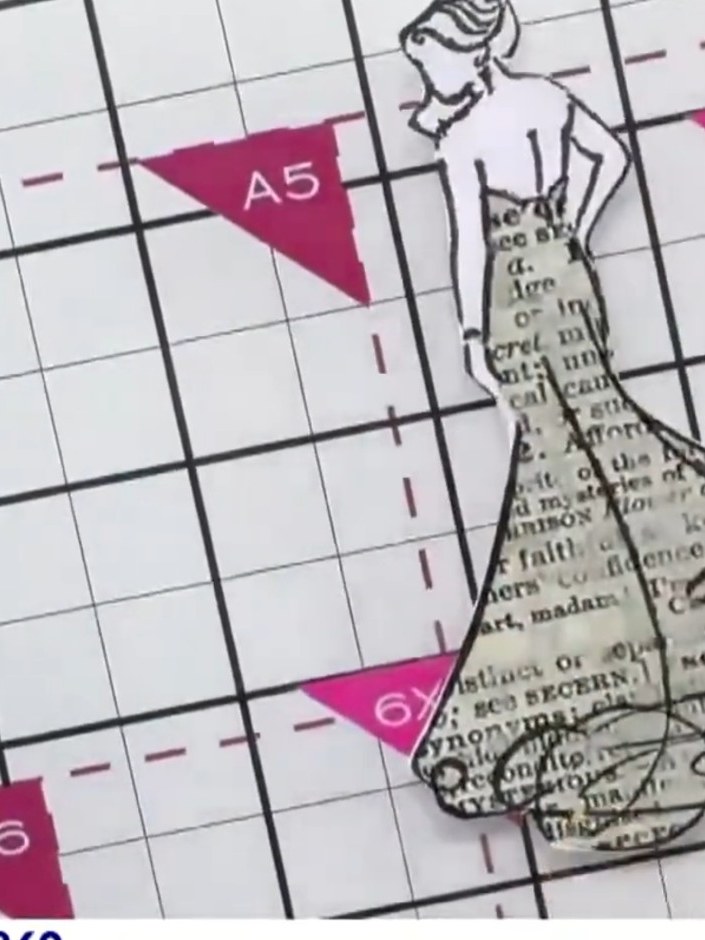 Stap 4: Using scissors, carefully cut away only the dress section from the stamped image on the patterned paper, leavi