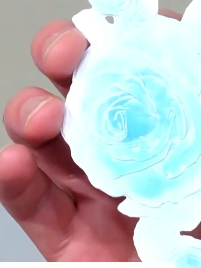 Stap 10: Add sparkle or additional embellishments to your embossed rose to finish the card. The blue embossed rose can 