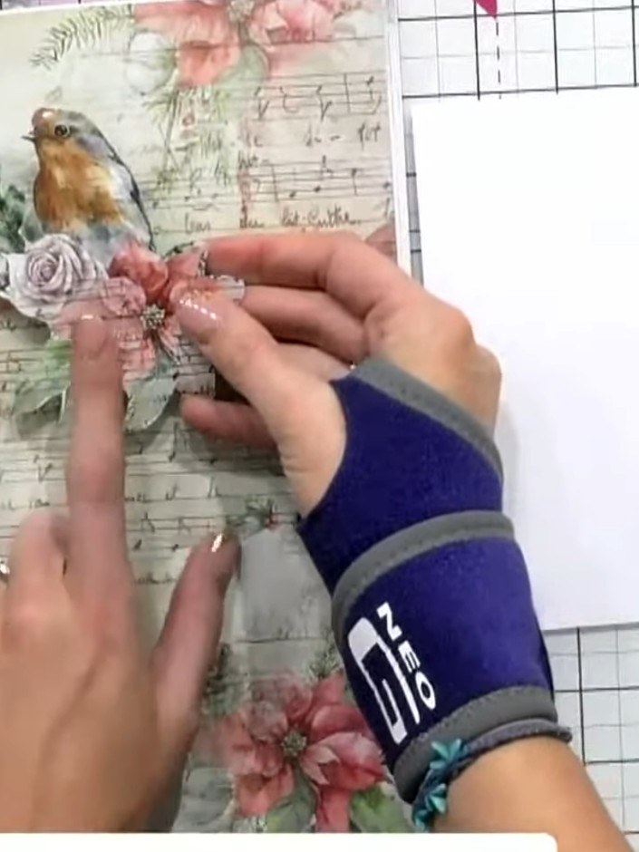 Step 1: Fussy cut the robin image from the patterned paper, carefully cutting around the bird and floral details to pr