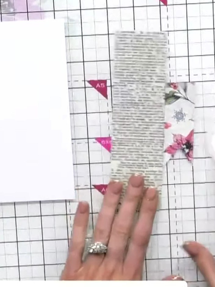 Step 2: Cut a panel of the newspaper print paper from the magazine kit to create your base layer for the card.