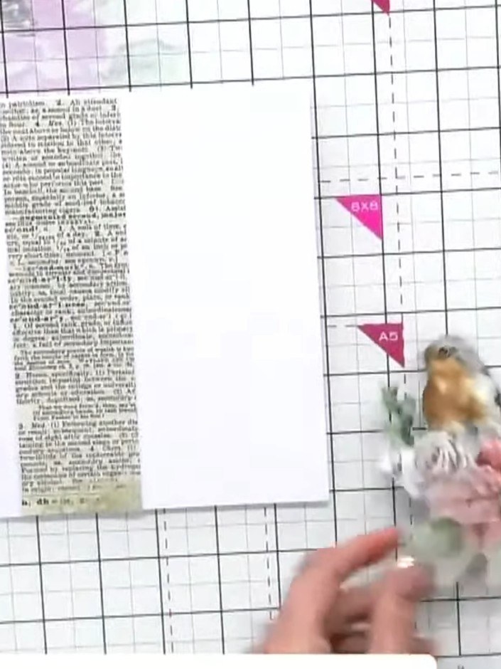 Step 5: Apply foam pads to the back of the fussy-cut robin image to add dimension to your card.