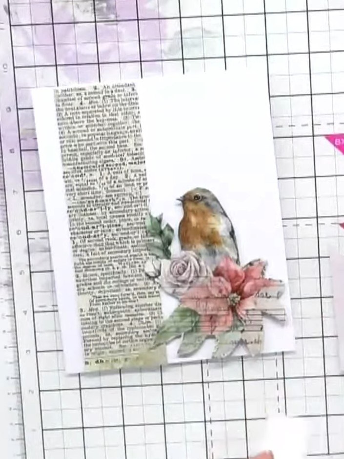 Step 9: Add sparkle to your card by applying glitter glue to selected areas of the flowers and robin for extra festive