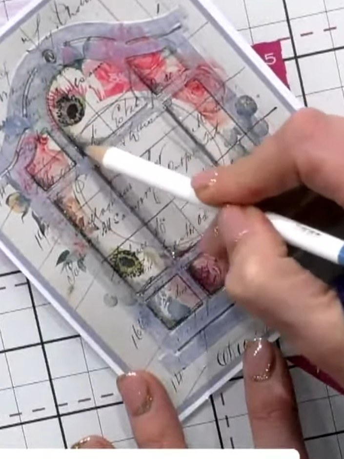 Step 8: Add sparkle or glitter inside the embossed window areas to create a snowy or festive effect if desired. Tilt y