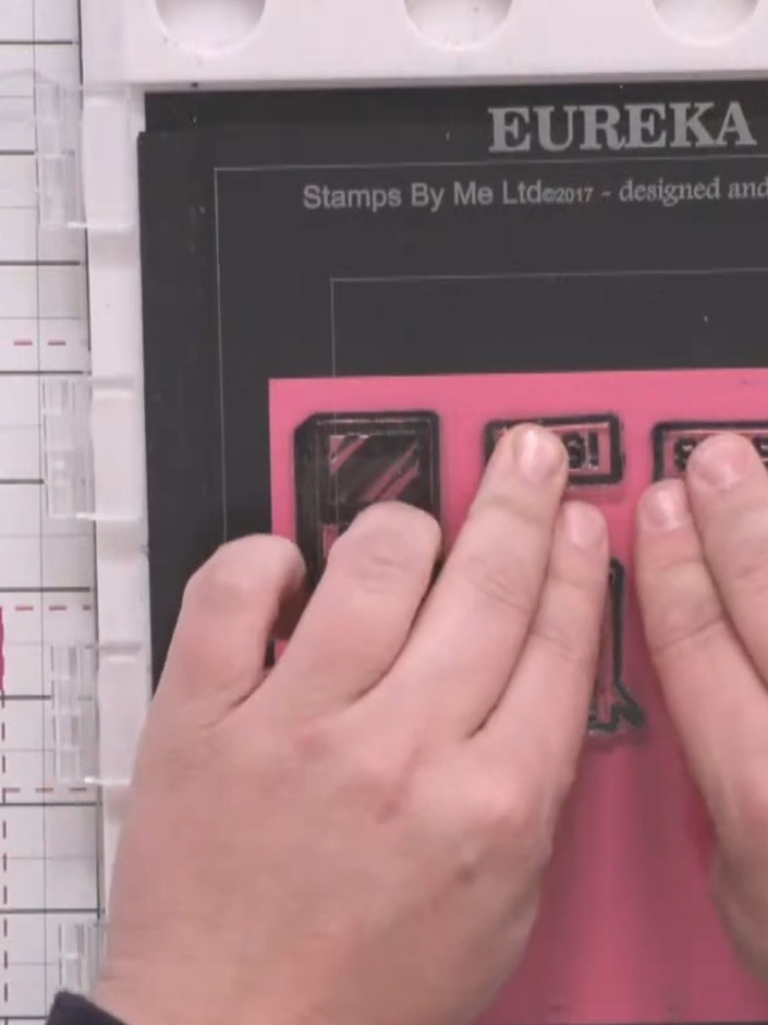 Step 5: Stamp sentiment images such as 'have a nice day', 'smile', 'OMG', or 'hello' onto the bright pink paper using 