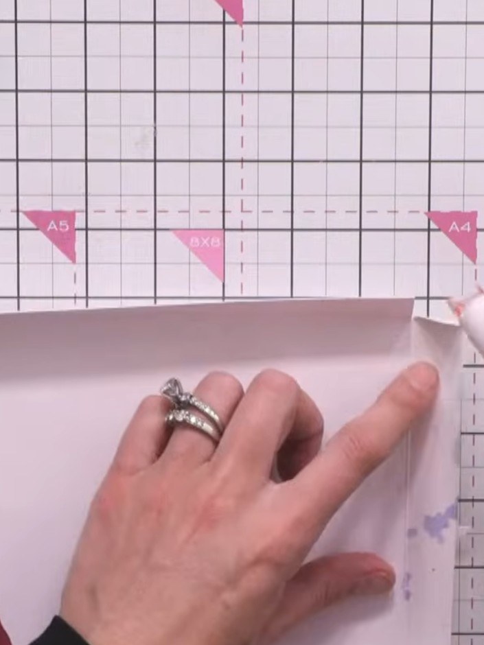 Step 6: Trim your stencilled artwork down to fit neatly on the lid, leaving a small border of the pearl card visible a