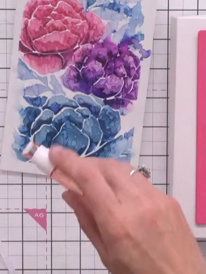 Step 7: Adhere the white die-cut peony frame to the stencilled watercolour background panel using 3D foam pads or tape