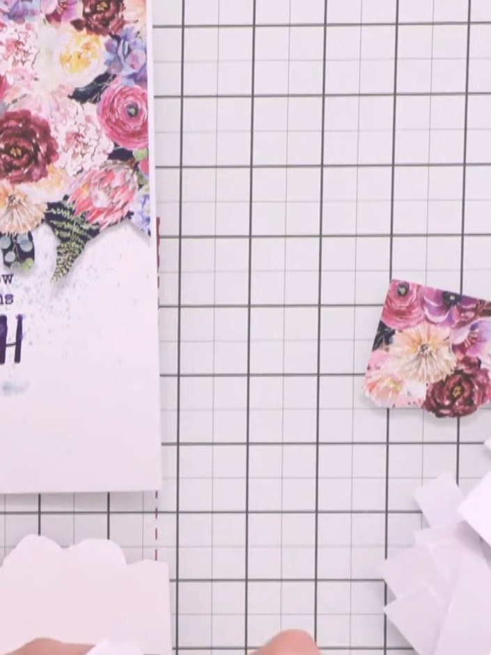 Passo 8: Take your first fussy-cut floral element and adhere it flat to the top of the card using wet glue or a glue pe