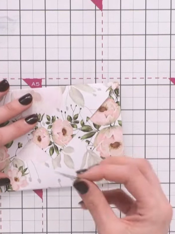 Step 3: Insert your card or message inside the folded envelope. The floral patterned card fits neatly within the envel