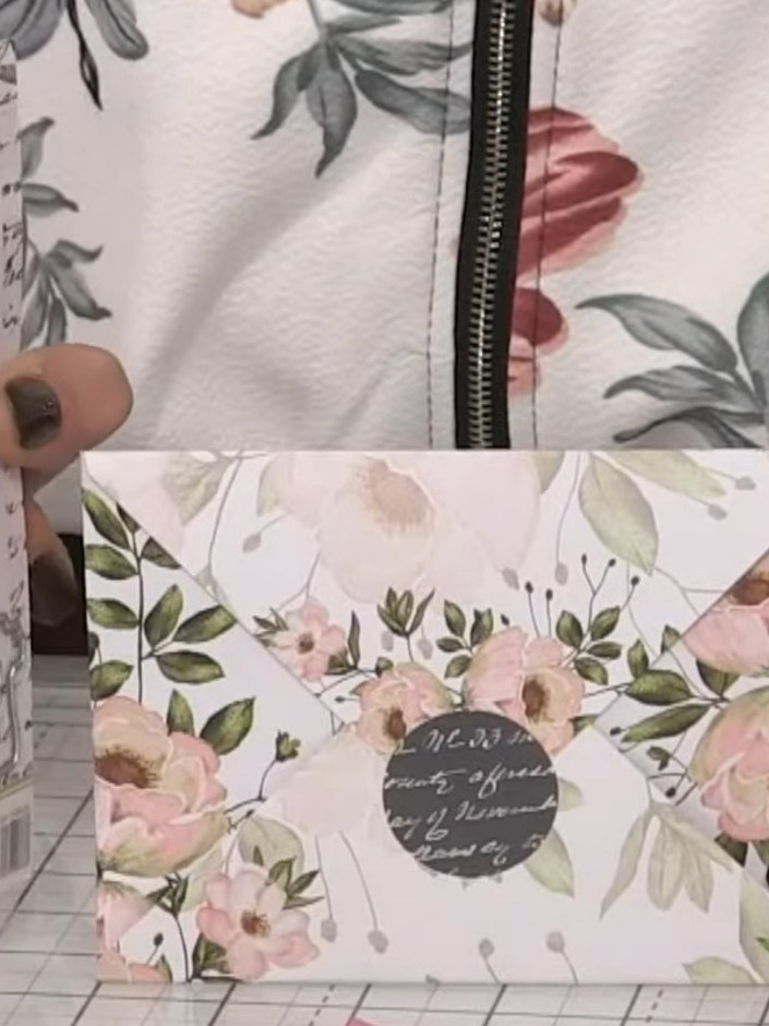 Step 5: Apply the coordinating sticker to the front of the sealed envelope to close it. Position the sticker centrally