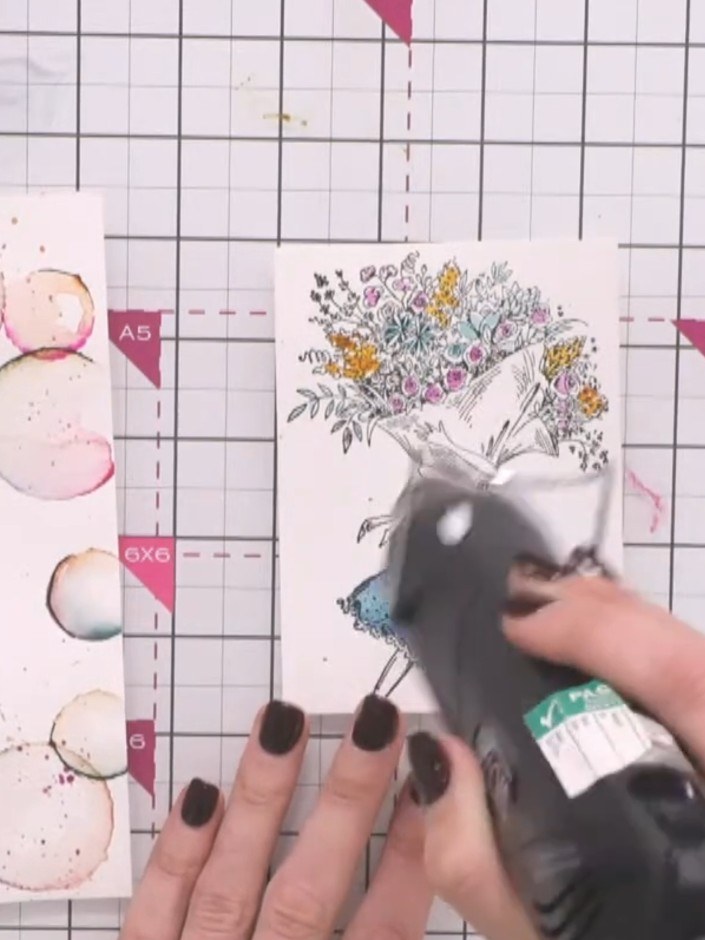 Stap 1: Mount the painted lady design onto a piece of pink card using tape or adhesive. Position it to showcase the bu