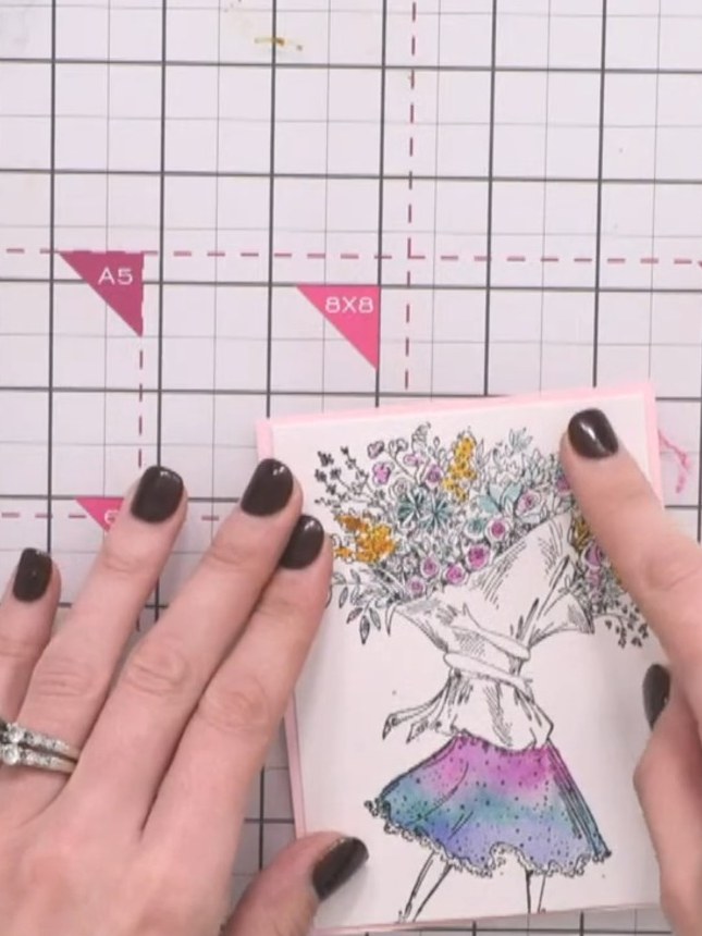 Stap 2: Stamp your chosen sentiment onto the card using black ink. Position the stamp in a clear area below the lady f