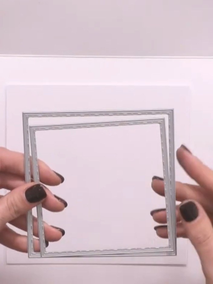 Passo 13: Cut a smaller aperture from a 6 x 6 inch piece of white cardstock using the next size down nesting die. This c