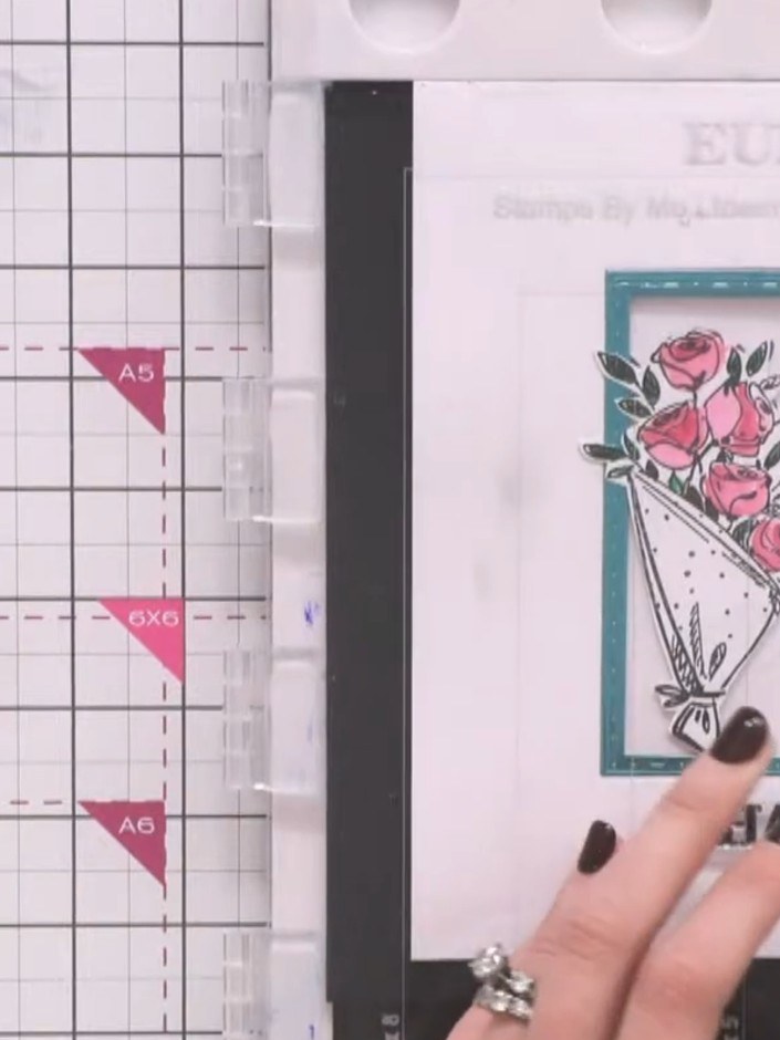 Passo 16: Stamp a sentiment such as 'THANK YOU' onto white cardstock using black ink. Position the sentiment on the card