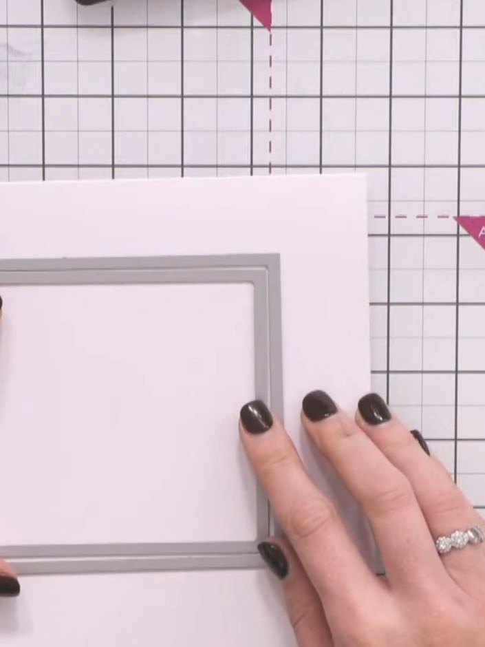Passo 2: Use a square nesting die to cut an aperture window through the front of your folded card base. Position the di