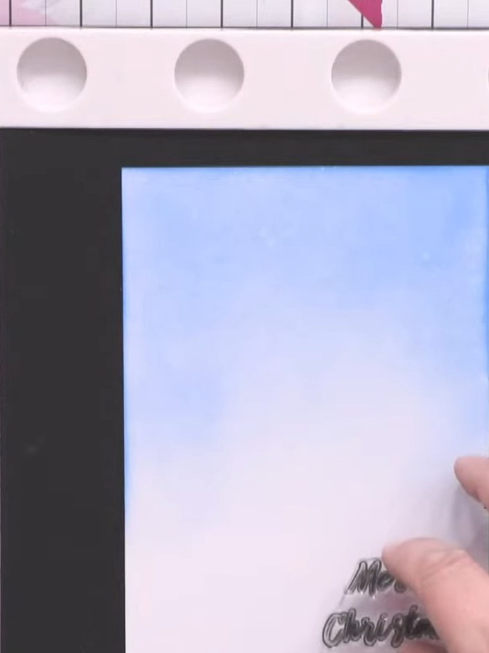 Passo 3: Stamp a sentiment onto the blue cardstock using embossing ink. Heat set the embossing with a heat gun to creat