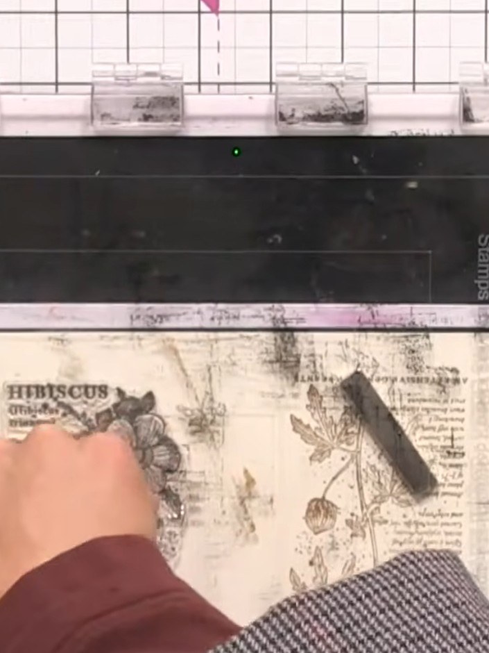 Step 3: Apply black ink to the stamp pad and add black ink to one side of the second stamped image, blending it in a c