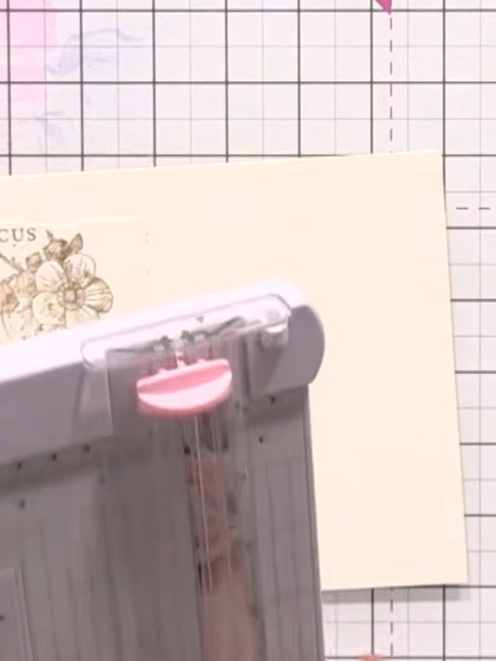 Step 6: Score lines down the centre of your cream card blank at half-inch intervals using a scoring tool to create the