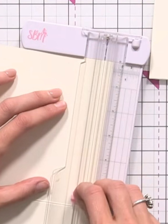 Step 7: Trim away the back flap and side flaps of the card blank using scissors to create the wallet pocket shape.