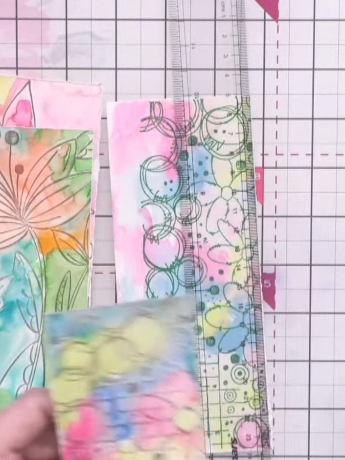 Passo 7: Tear all the stamped and coloured pieces into various sizes and shapes, tearing freehand along the edges for a