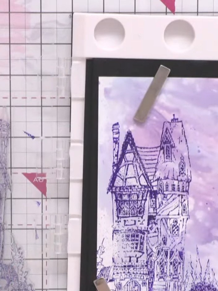 Paso 2: Select purple ink colours for your offset stamping technique. Position the Rickety House stamp on your acrylic