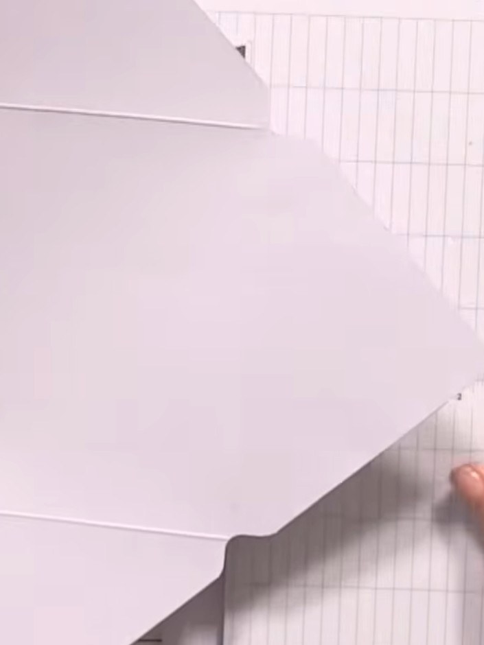 Step 2: Using the box board template, score and cut along the marked lines as you did with the main envelope. Cut the 