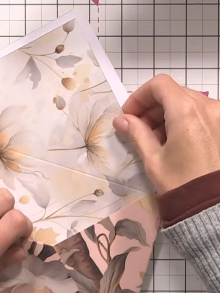 Step 5: Round off the pointed corner of the envelope flap using a corner punch tool to create a smooth, curved edge.